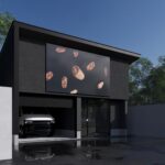 北九州・沖縄の注文住宅｜北九州市|巨大ﾃﾞｼﾞﾀﾙ看板と黒い外観が印象的。車庫・倉庫・無人店舗(ﾊﾟﾝ販売)を集約したモダンな建物。